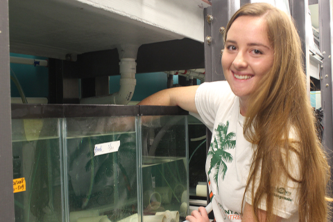 Undergraduate research assistant Gabrielle performing lab duties 